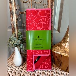 Kate Spade Reversible Drying Mat set in a red and pink hearts pattern.